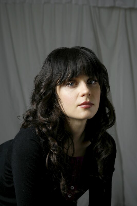 woman with dark hair and bangs