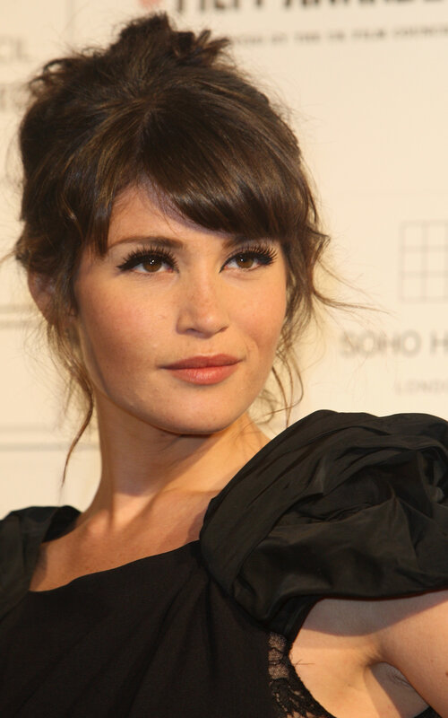 woman with dark hair and black dress