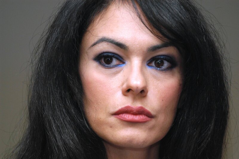 woman with dark hair and blue eyeliner