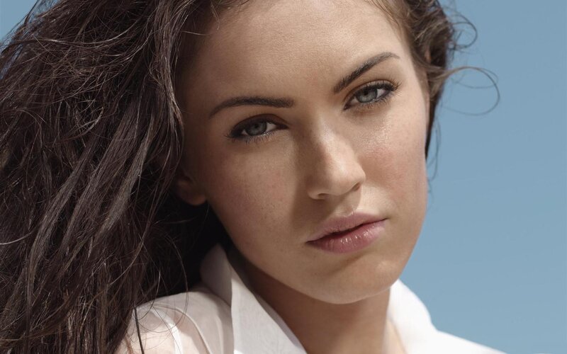 woman with dark hair and blue eyes
