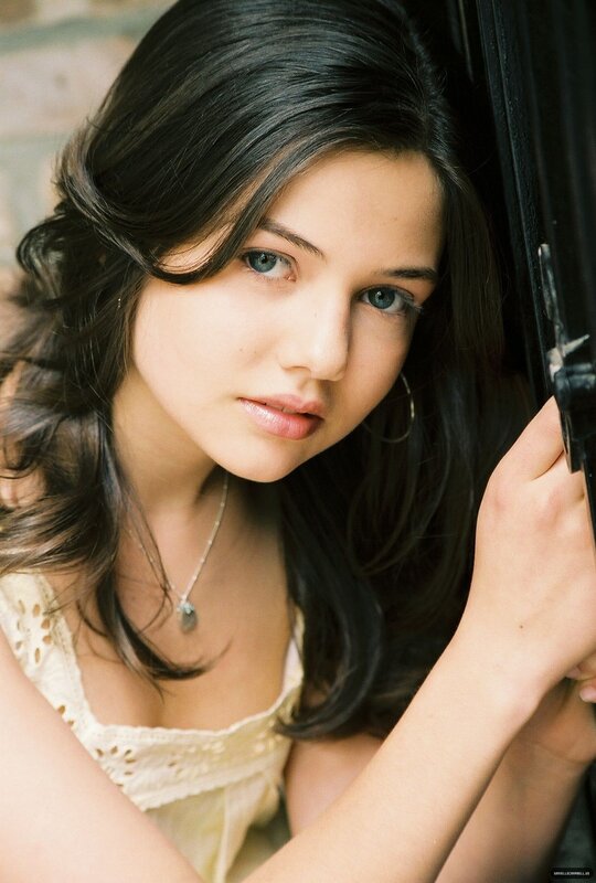 woman with dark hair and blue eyes