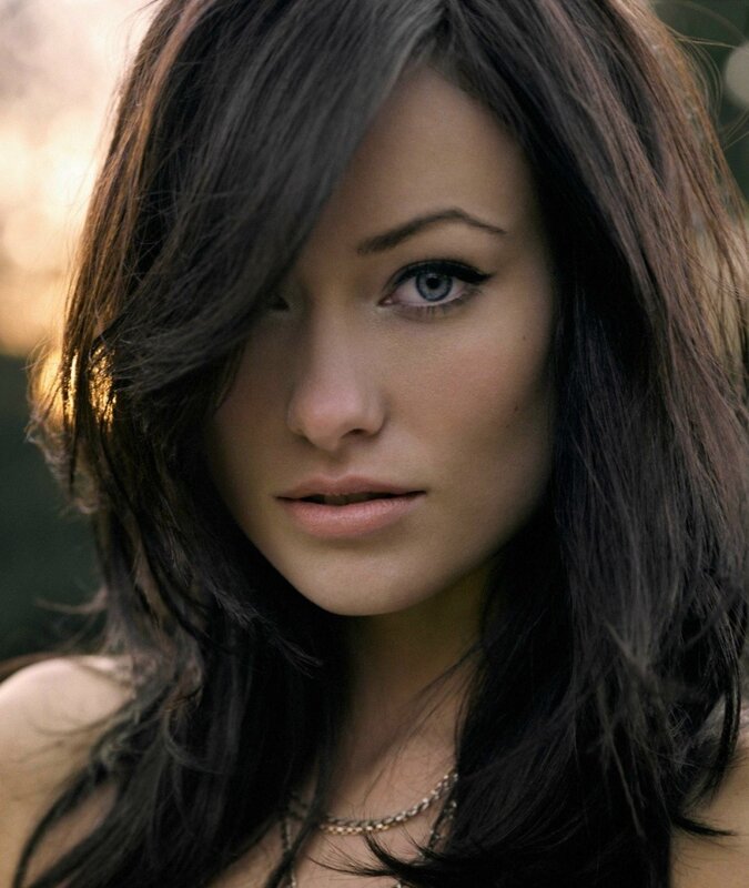 woman with dark hair and blue eyes
