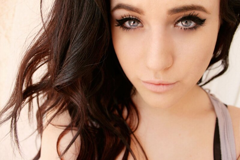 woman with dark hair and blue eyes