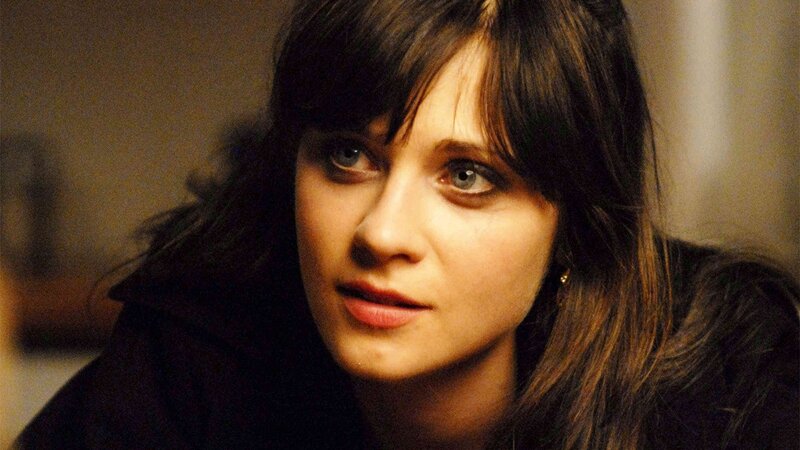 woman with dark hair and blue eyes