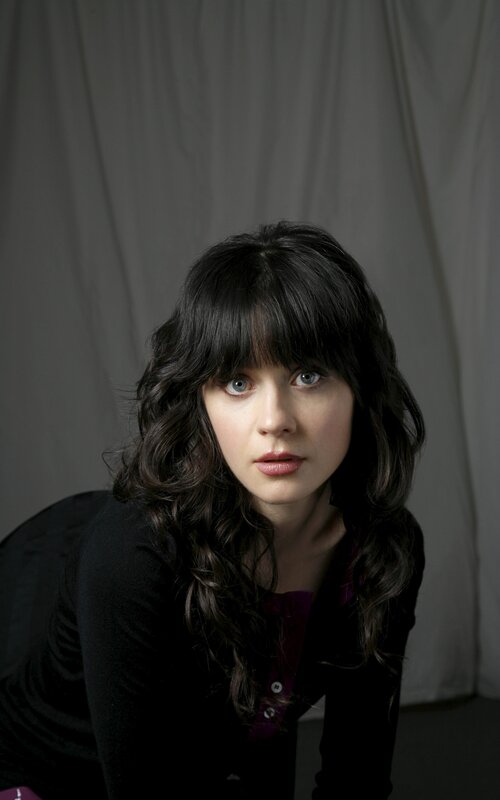 woman with dark hair and blue eyes