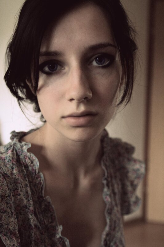 woman with dark hair and blue eyes