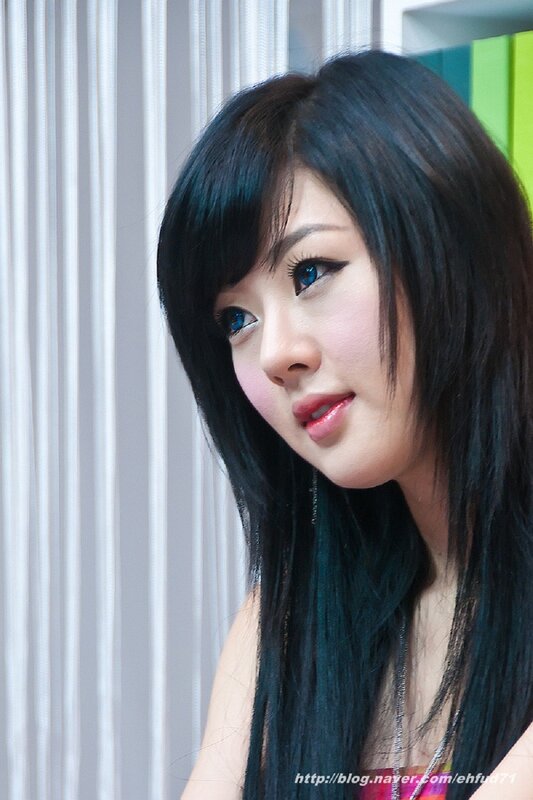 woman with dark hair and blue eyes