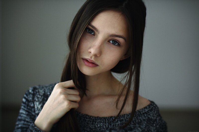 woman with dark hair and blue eyes