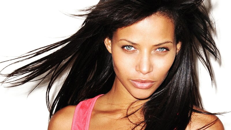woman with dark hair and blue eyes