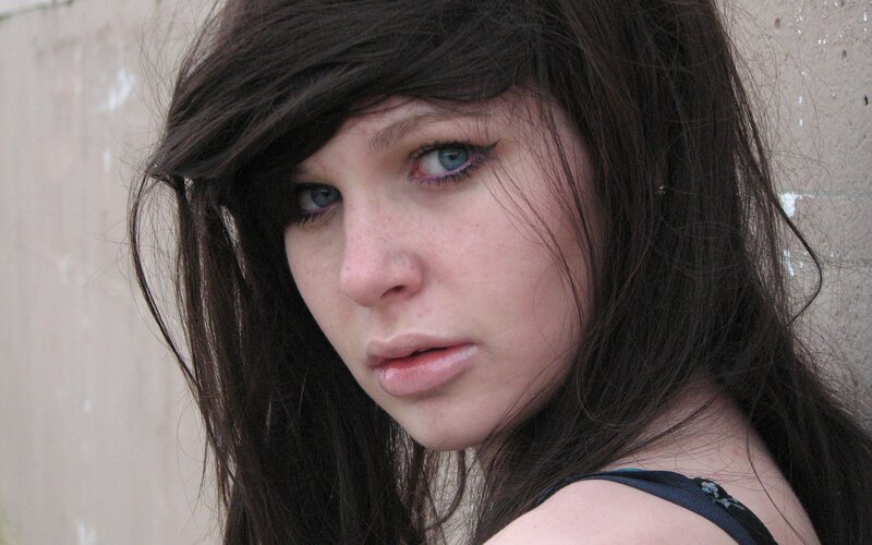 woman with dark hair and blue eyes