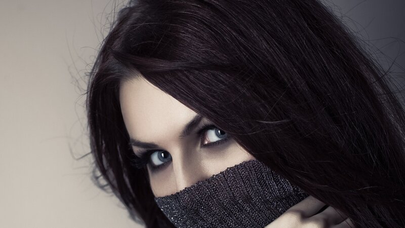 woman with dark hair and blue eyes