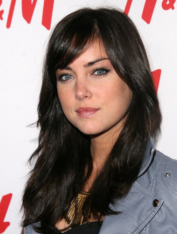 woman with dark hair and blue eyes