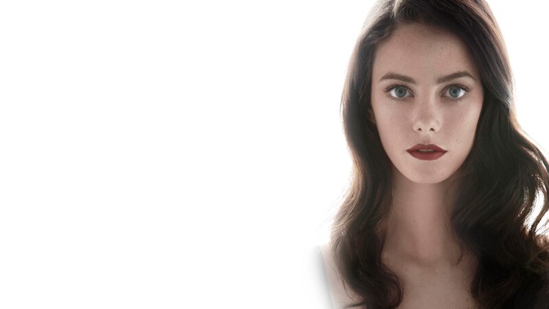 woman with dark hair and blue eyes