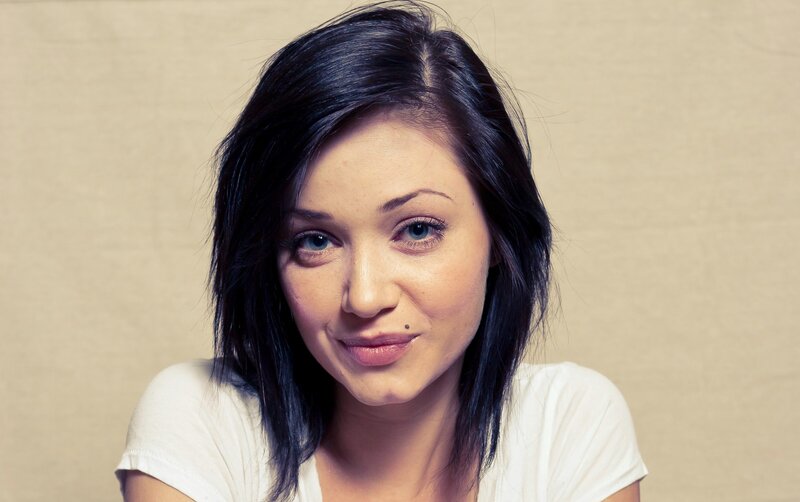 woman with dark hair and blue eyes