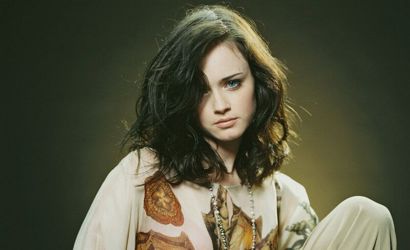 woman with dark hair and blue eyes
