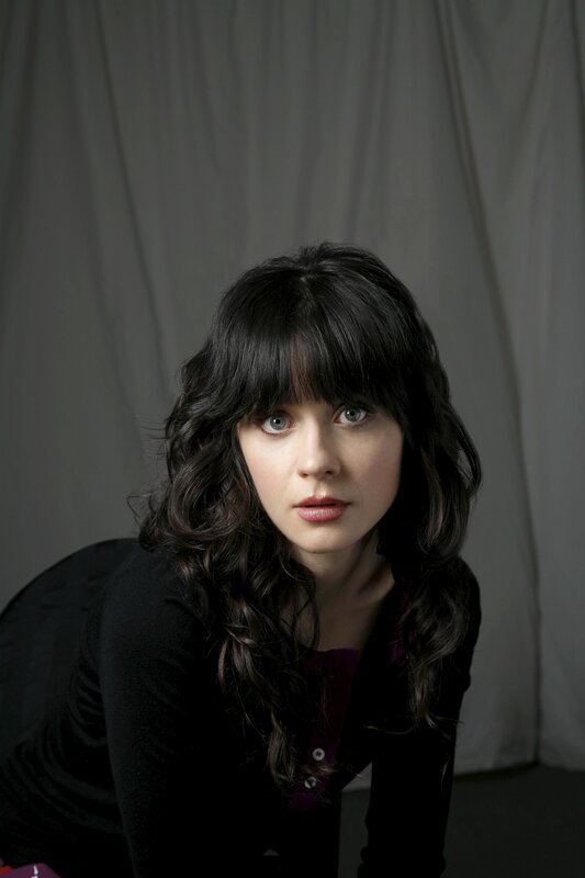 woman with dark hair and blue eyes