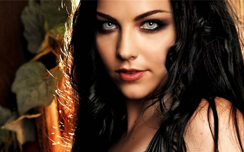 woman with dark hair and blue eyes