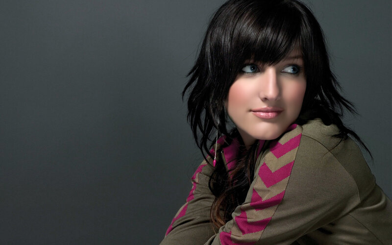 woman with dark hair and blue eyes
