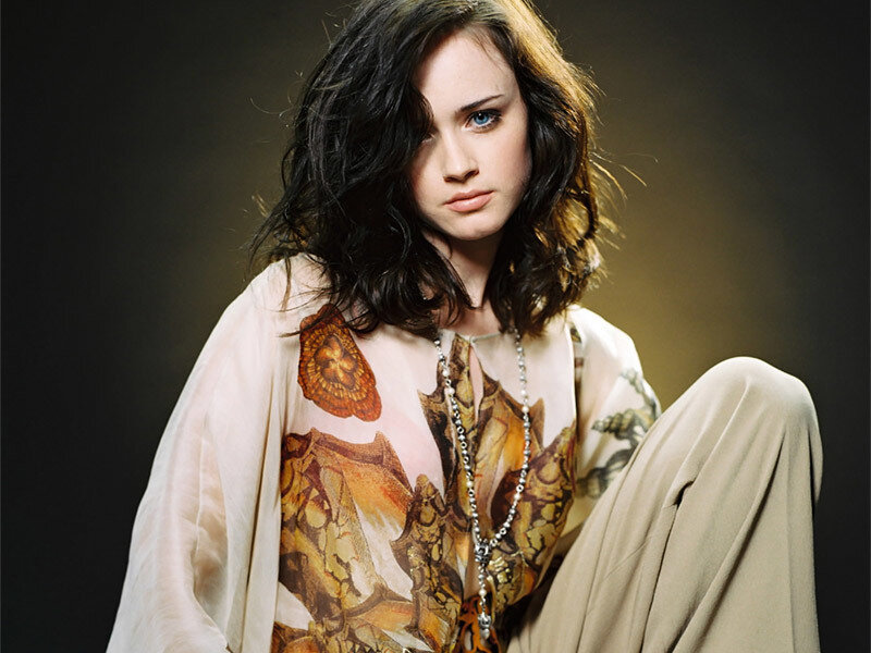 woman with dark hair and blue eyes