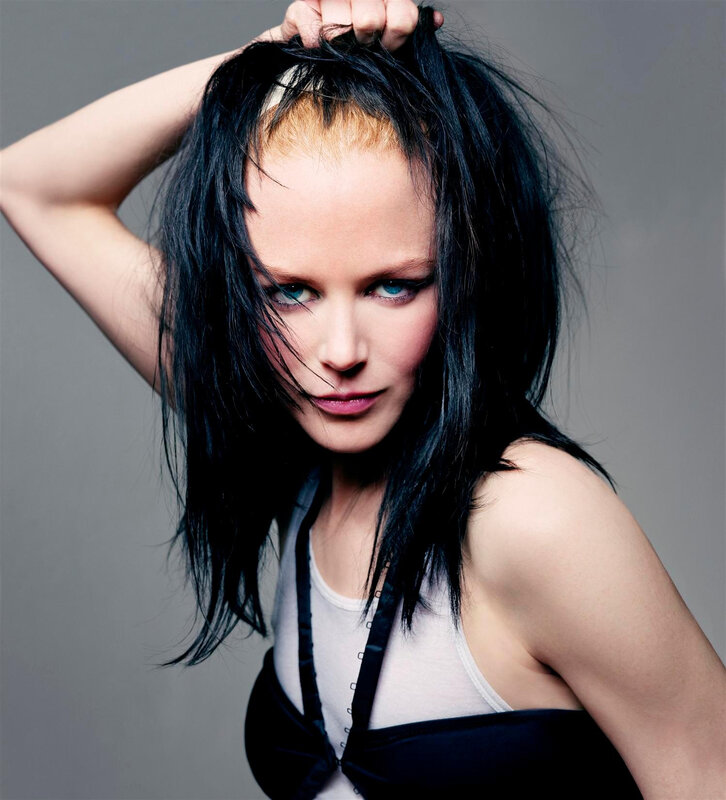 woman with dark hair and blue eyes