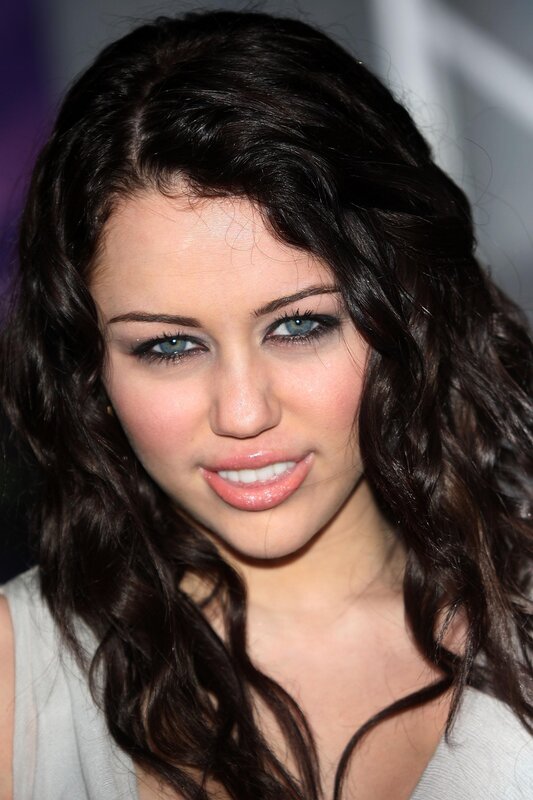 woman with dark hair and blue eyes