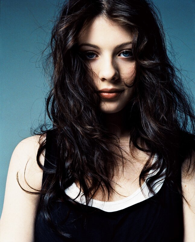 woman with dark hair and blue eyes