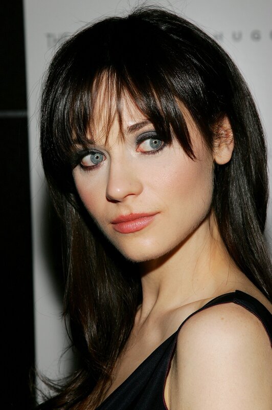woman with dark hair and blue eyes