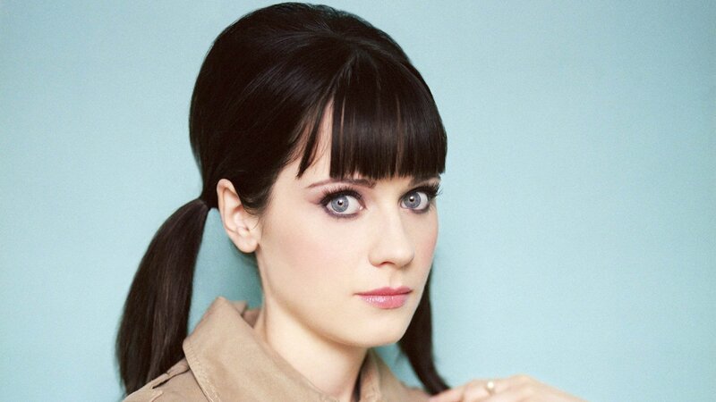 woman with dark hair and blue eyes