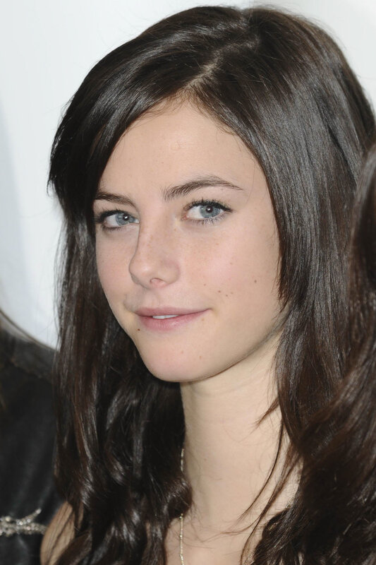 woman with dark hair and blue eyes