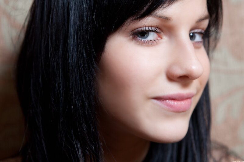 woman with dark hair and blue eyes