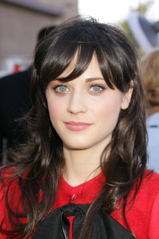 woman with dark hair and blue eyes