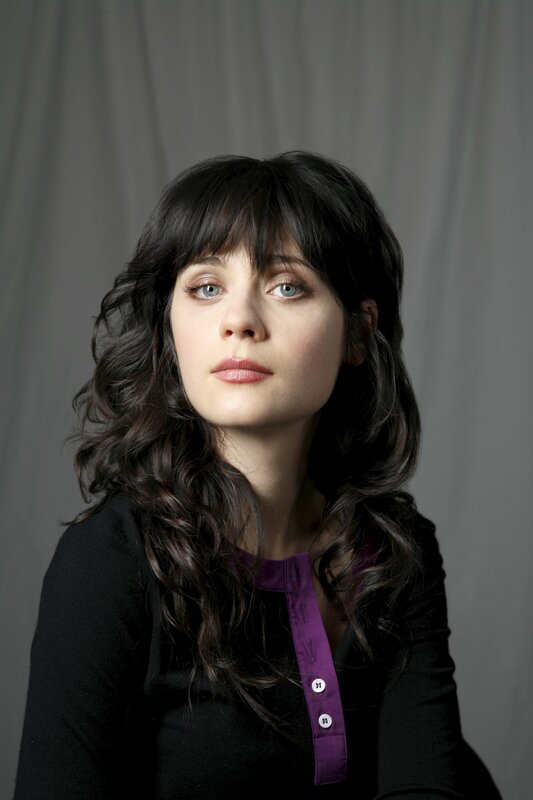 woman with dark hair and blue eyes