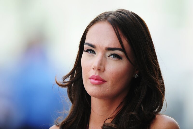 woman with dark hair and blue eyes