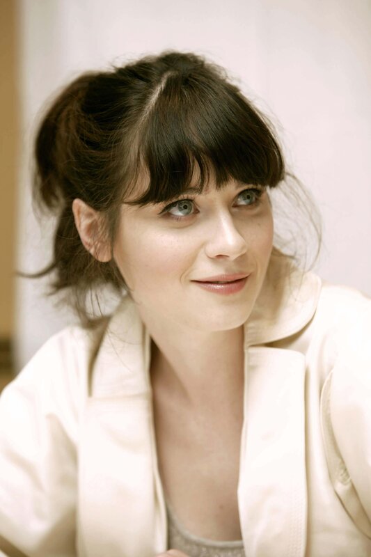 woman with dark hair and blue eyes