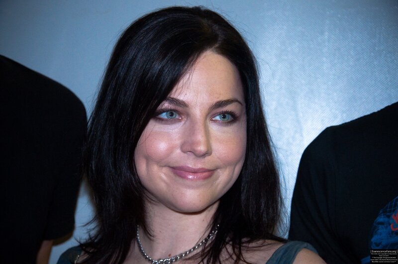 woman with dark hair and blue eyes