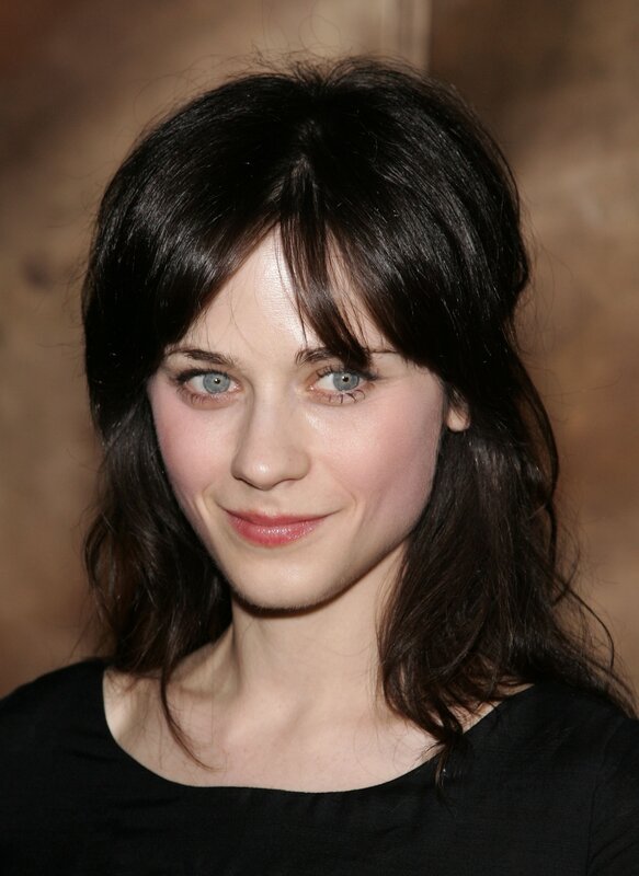 woman with dark hair and blue eyes