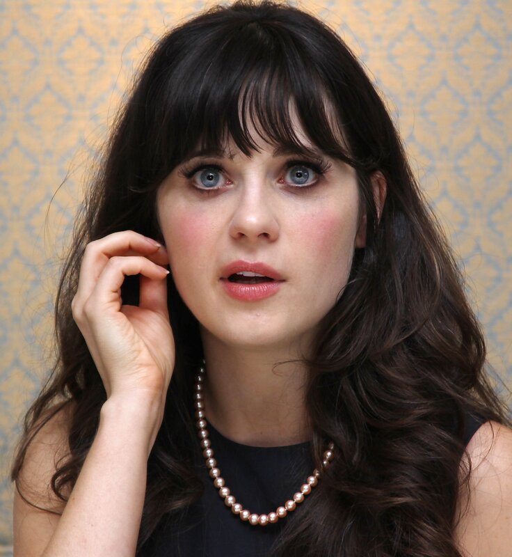 woman with dark hair and blue eyes