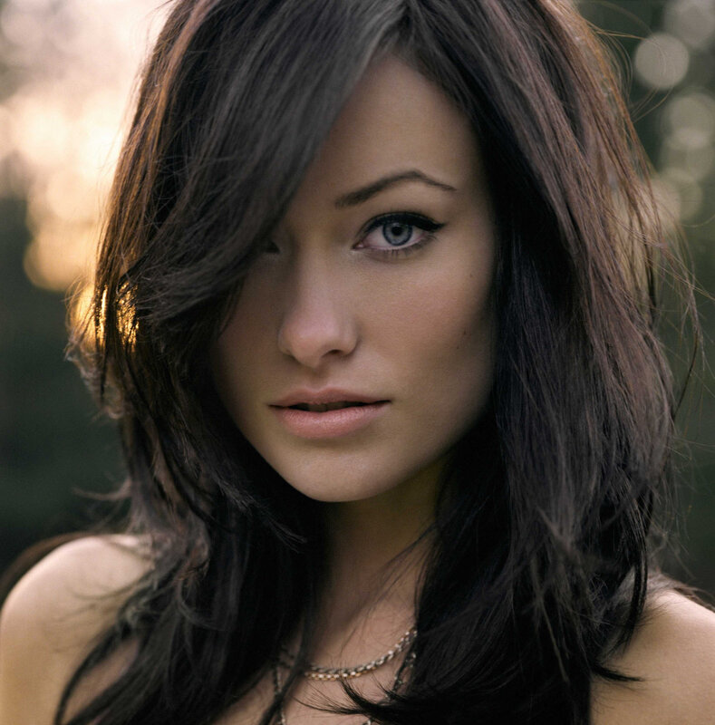 woman with dark hair and blue eyes