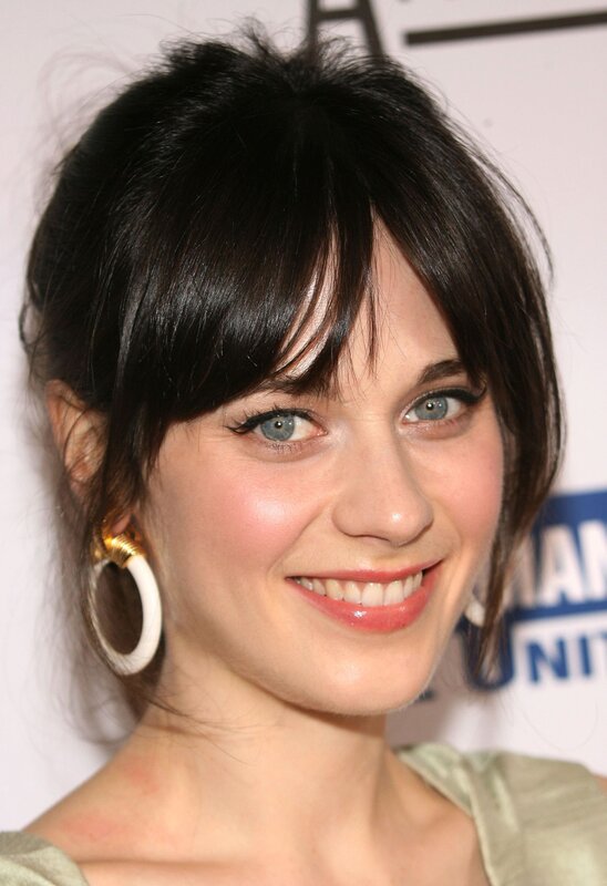 woman with dark hair and blue eyes