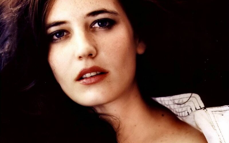 woman with dark hair and blue eyes