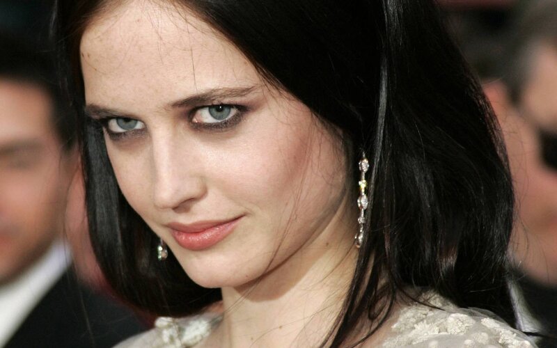 woman with dark hair and blue eyes