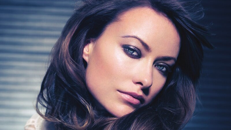 woman with dark hair and blue eyes