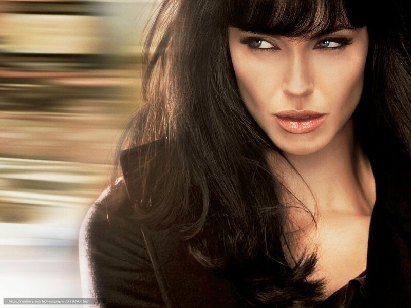 woman with dark hair and blue eyes