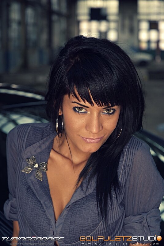 woman with dark hair and blue shirt