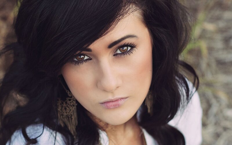 woman with dark hair and brown eyes