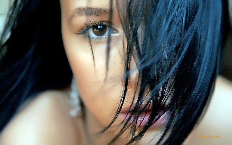 woman with dark hair and brown eyes