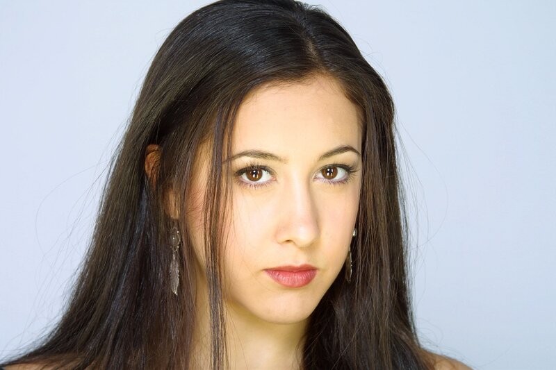 woman with dark hair and brown eyes