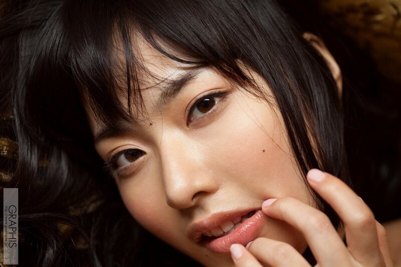 woman with dark hair and brown eyes