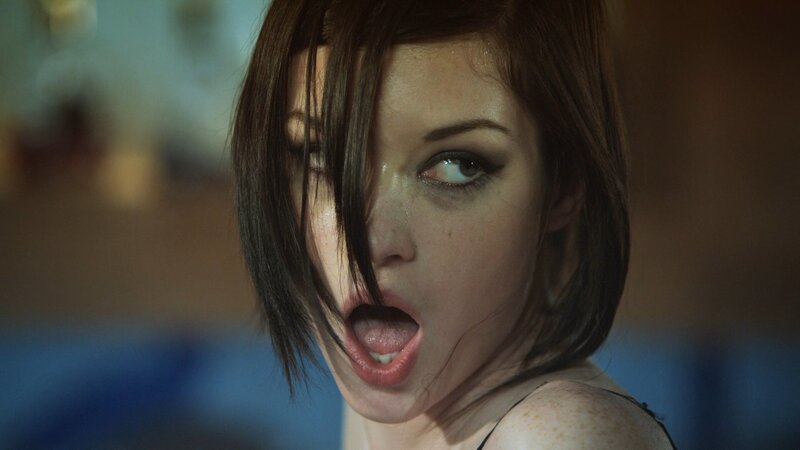 woman with dark hair and dramatic makeup