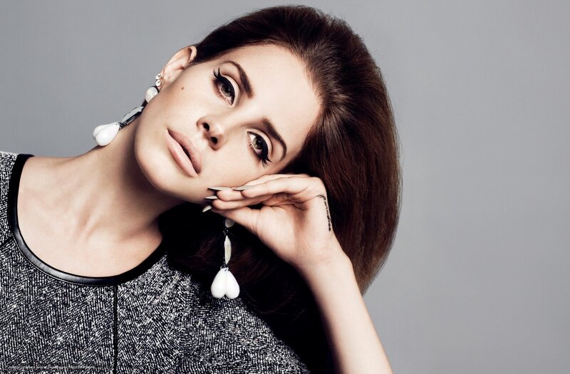 woman with dark hair and earrings